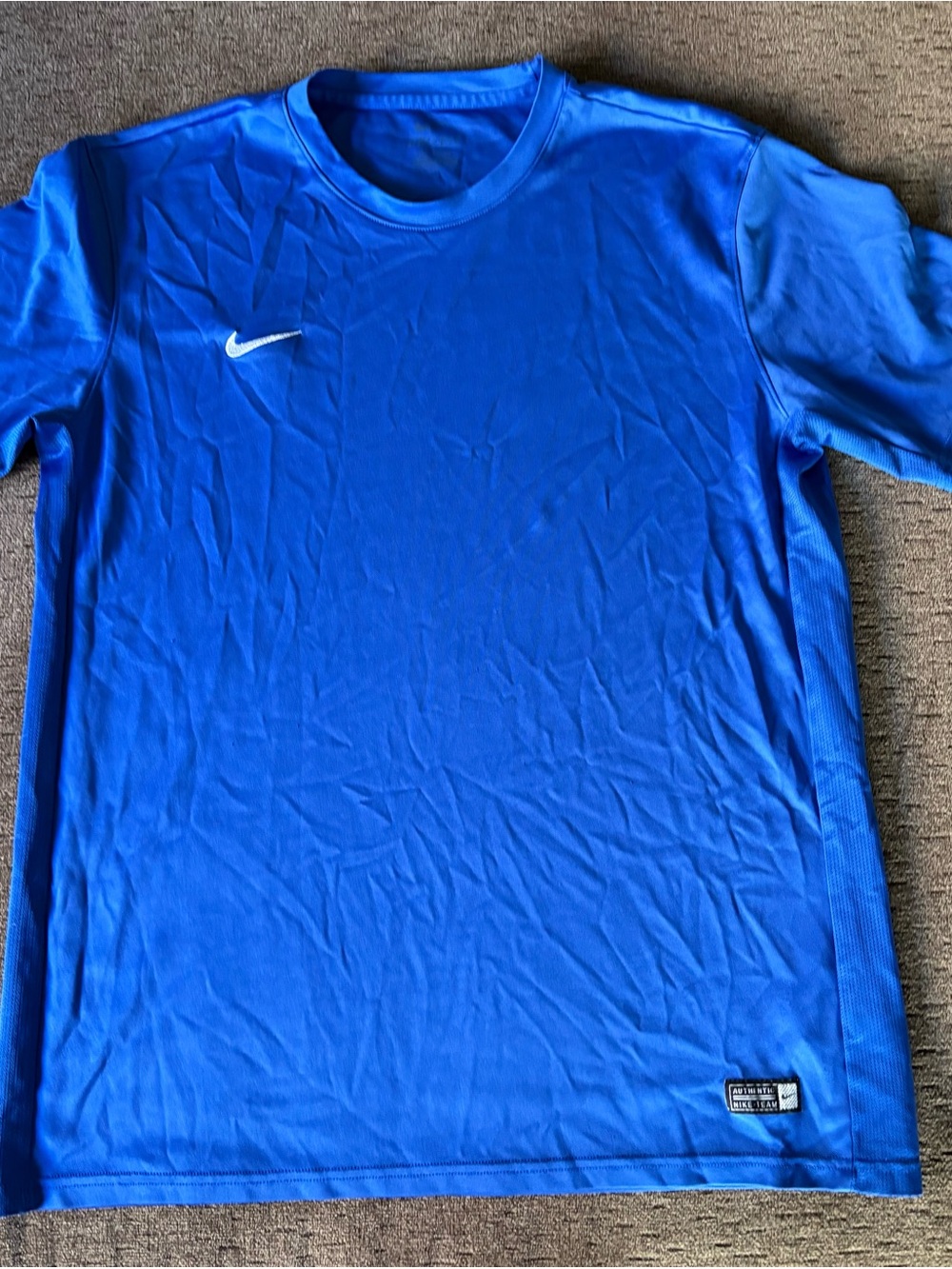 Nike Kids Royal Blue Short Sleeve Athletic Jersey with White Swoosh Logo